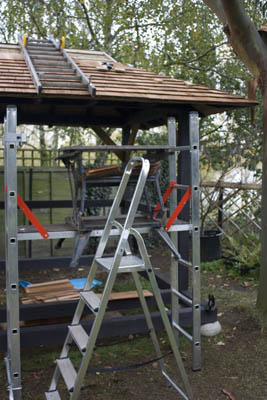 click to enlarge laying top shingles